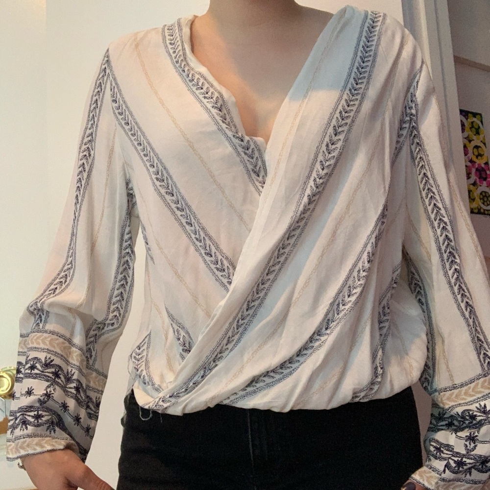 beige patterned long sleeve blouse